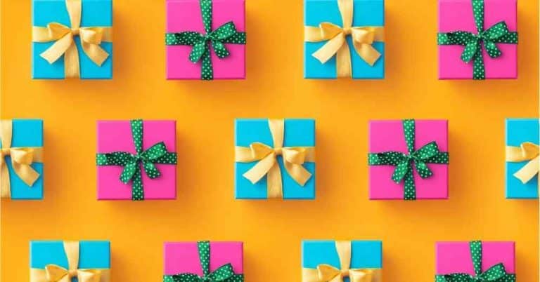 Gifts for art students in green, pink and orange with gold ribbon.