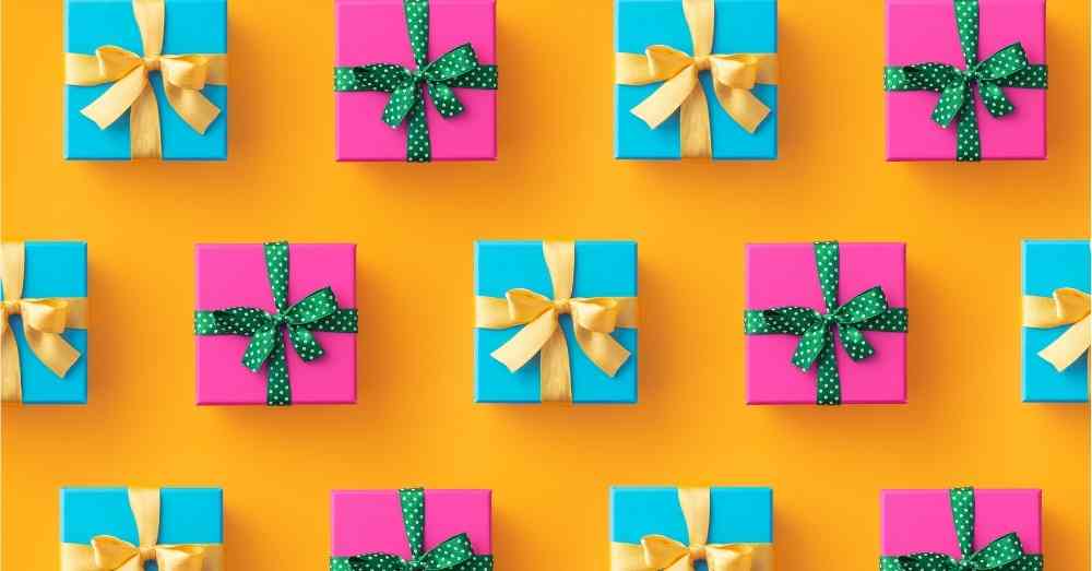 Gifts for art students in green, pink and orange with gold ribbon.