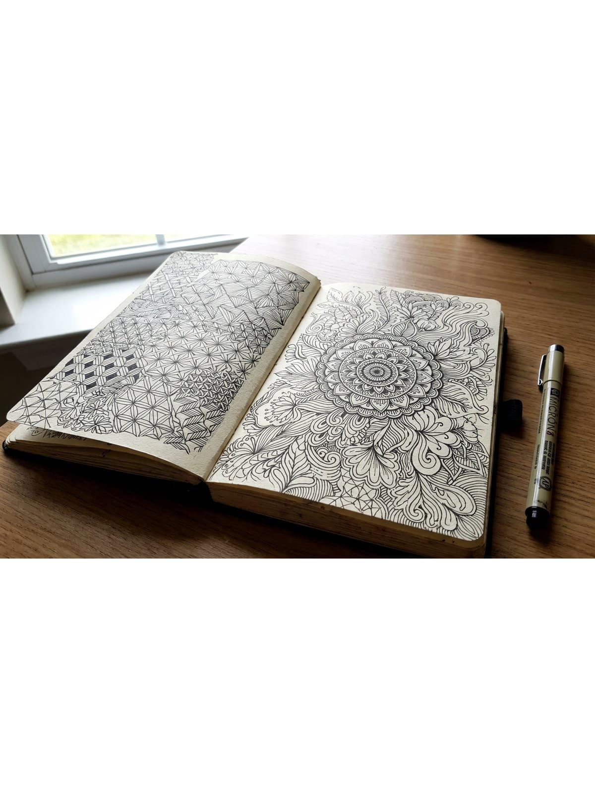 Abstract ink patterns and doodle ideas showing zentangle geometric and freeform pen designs in a sketchbook