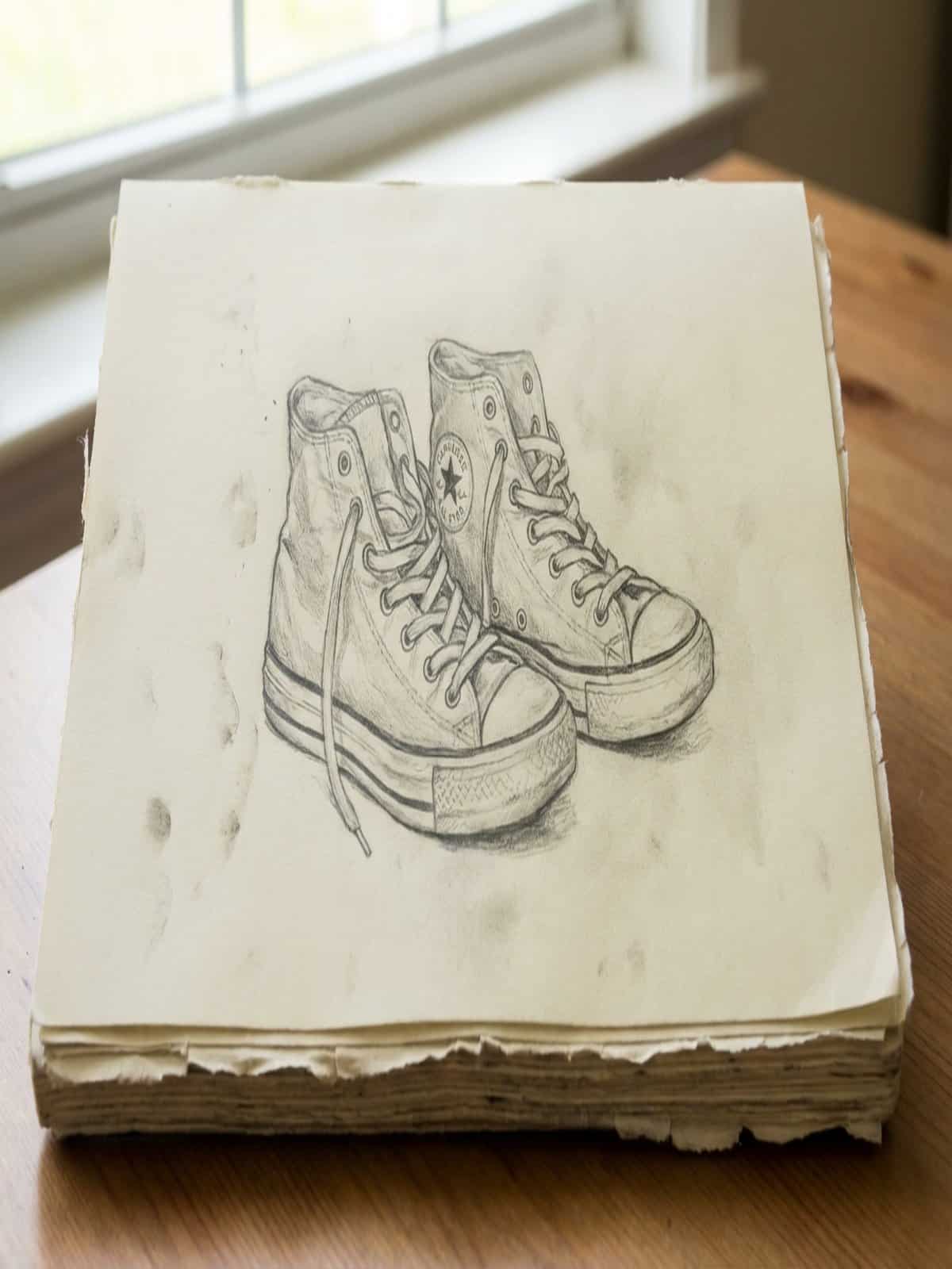 Around the house drawing ideas showing a pair of sneakers sketched in a sketchbook