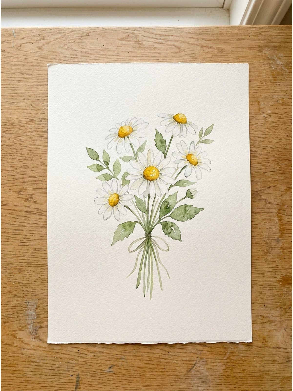 Loose watercolor painting of daisies on cold press watercolor paper