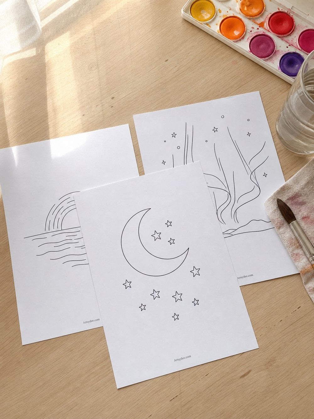 Free printable sunset and sky outline templates laid out with a watercolour palette