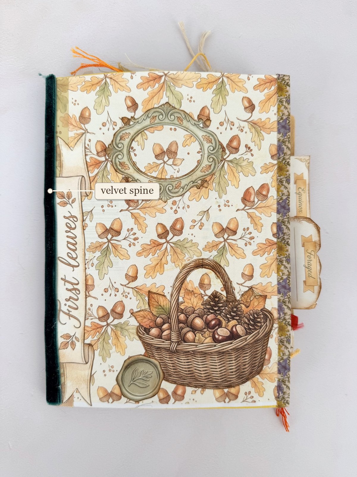 Autumn acorn junk journal cover with a dark green velvet spine