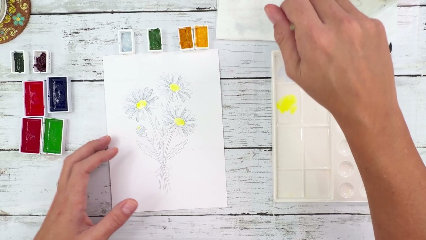 Painting the lemon yellow daisy centres with warm golden yellow dropped in around the edges