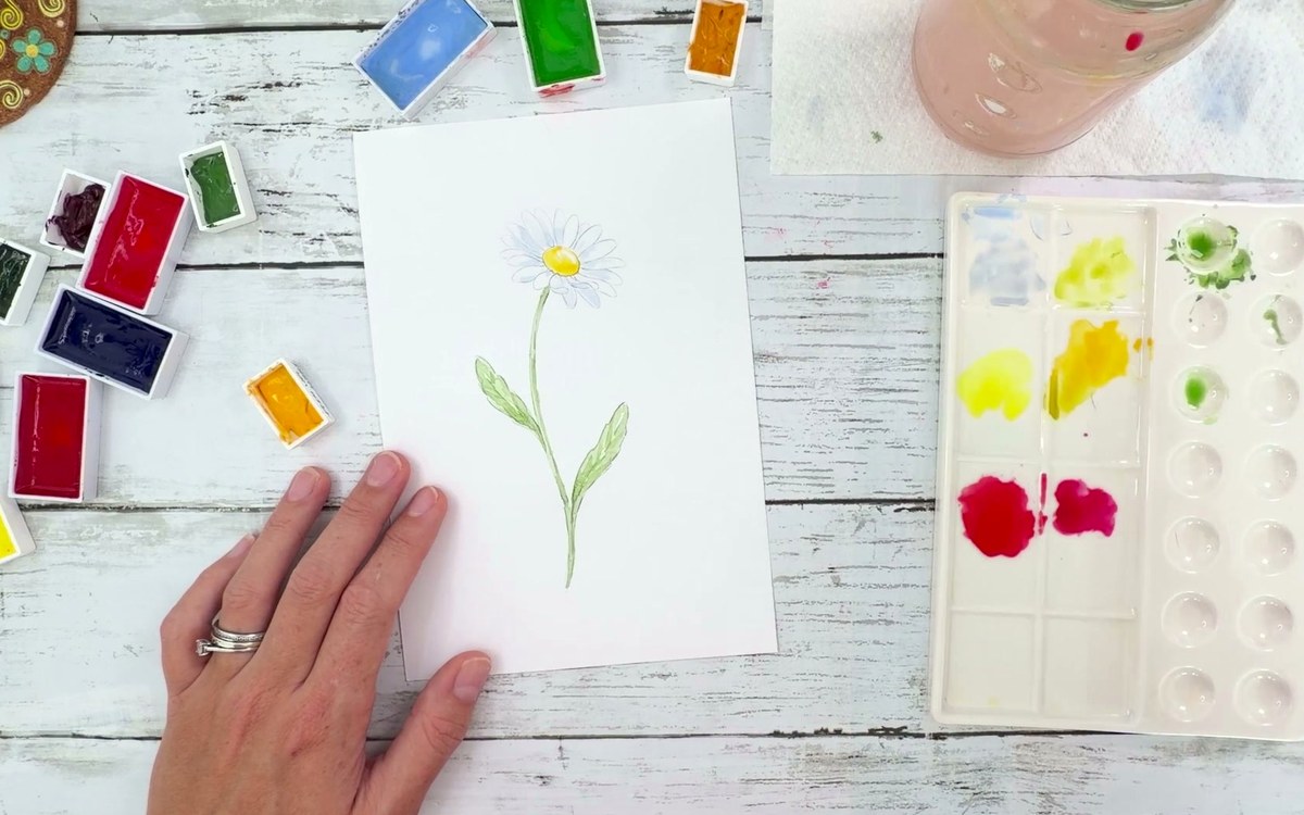 Dee's real finished watercolour daisy, painted along with the 4-minute video lesson, on her desk