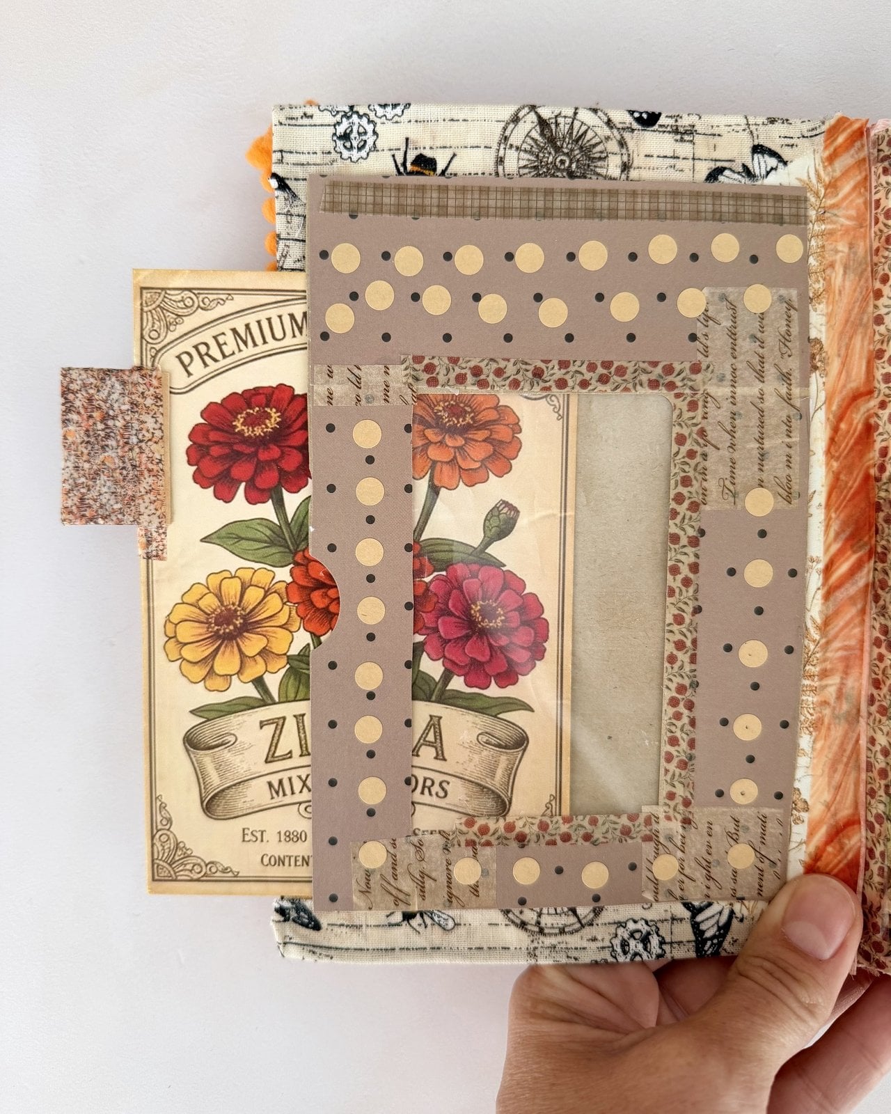 Window pocket with a see-through panel over a vintage zinnia seed packet card
