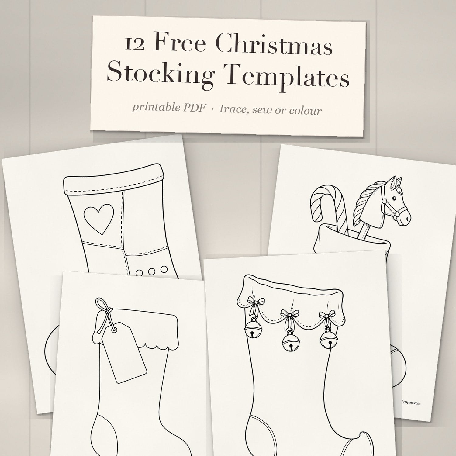 Printed Christmas stocking templates fanned out on a white-washed desk under a cream title card reading 12 Free Christmas Stocking Templates