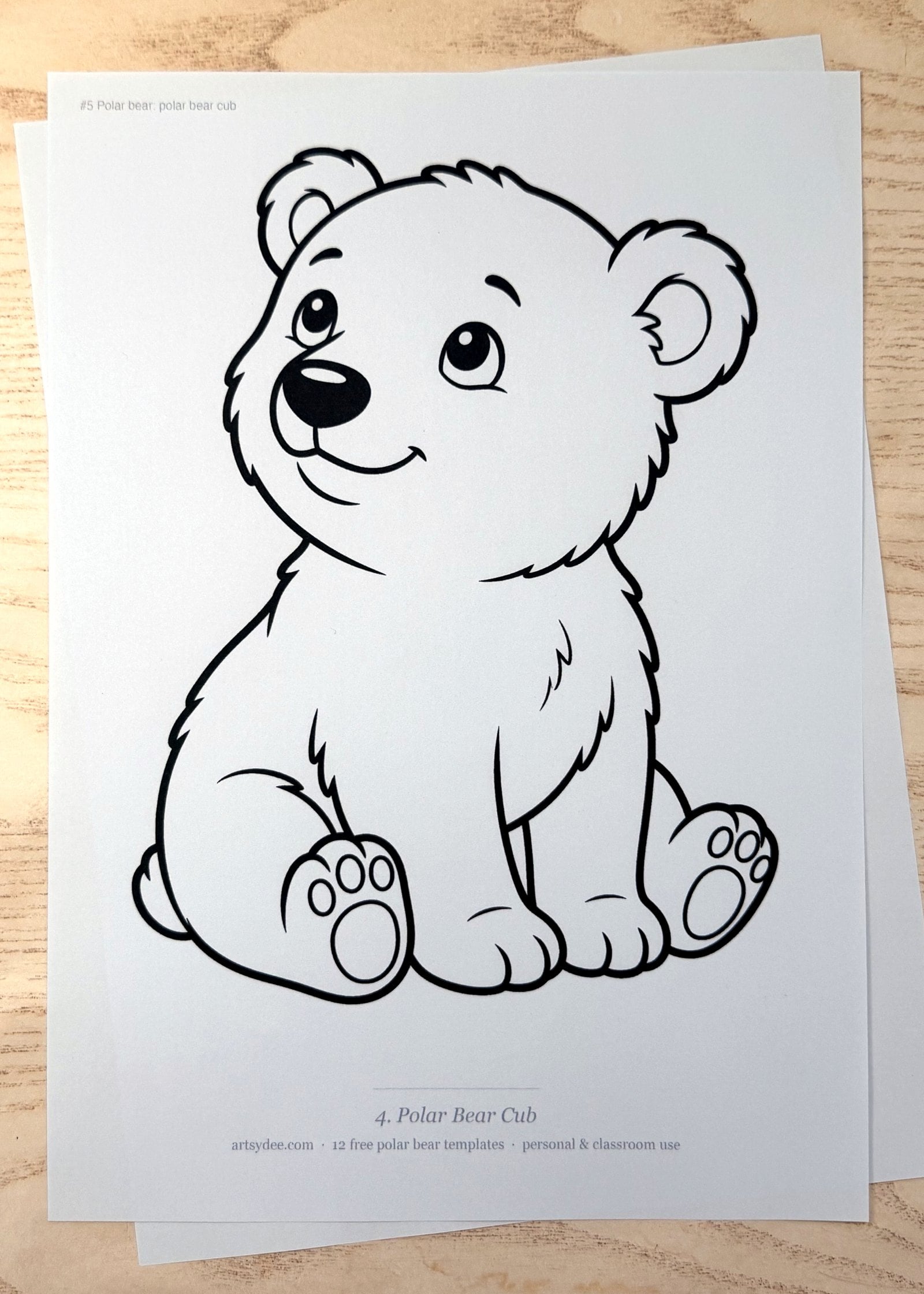 The free Polar Bear Templates printed on paper and photographed on Dee's desk at Artsydee