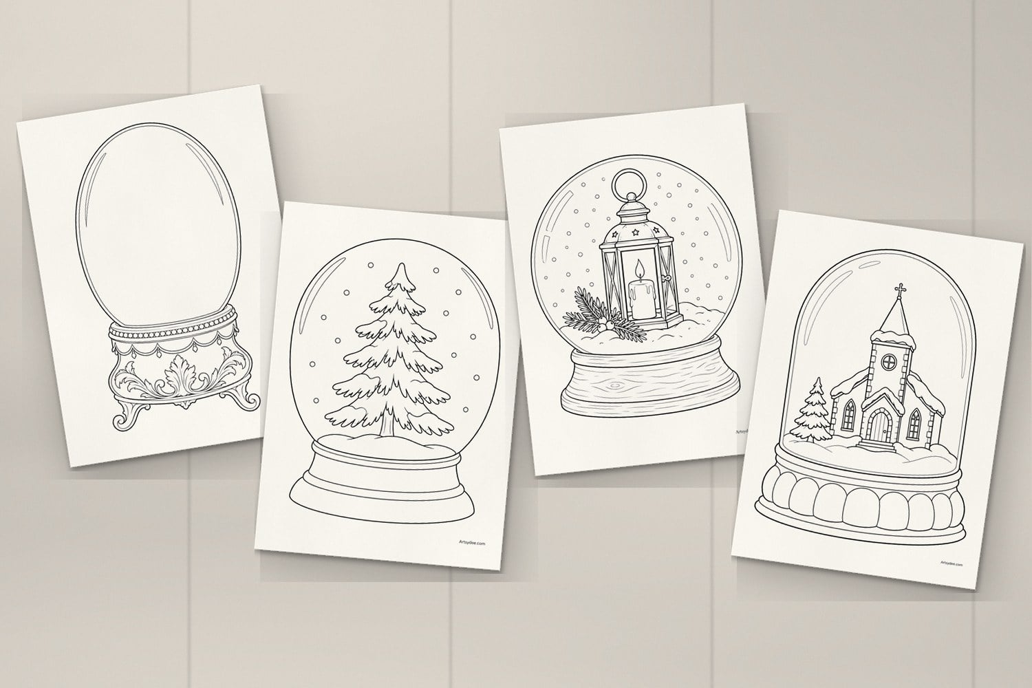 Four printed snow globe templates on a desk: the ornate Victorian base globe, the fir tree, the lantern and the little church