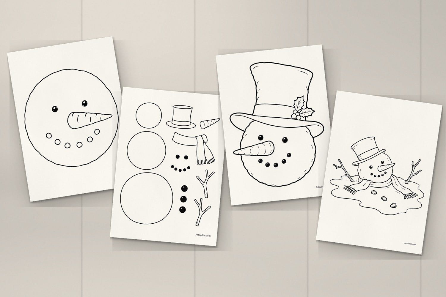 Four printed snowman templates on a desk: the snowman face, the build-a-snowman pieces, the snowman head in a top hat and the melting snowman