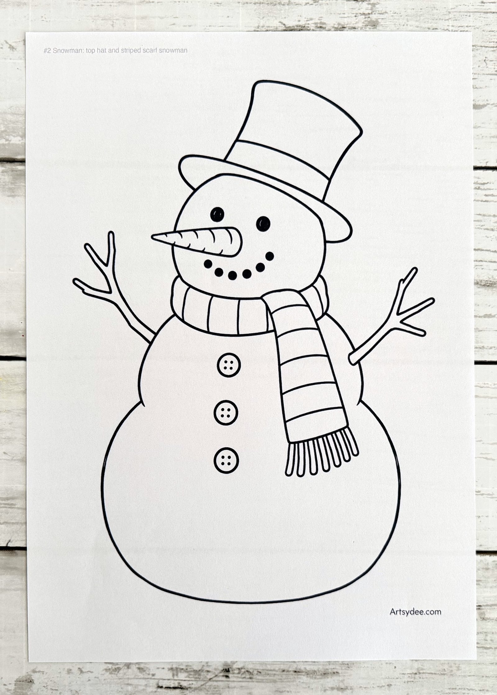 The free Snowman Templates printed on paper and photographed on Dee's desk at Artsydee